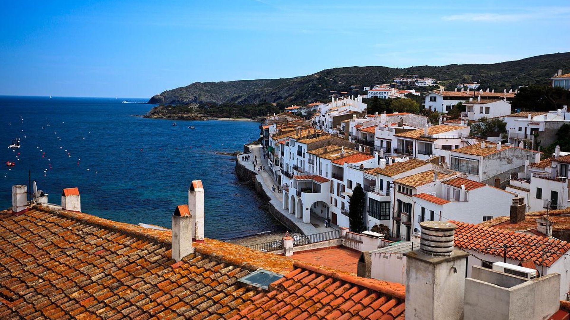 basque fishing village in northern spain with colorful houses, fishing boats, and coastal cliffs